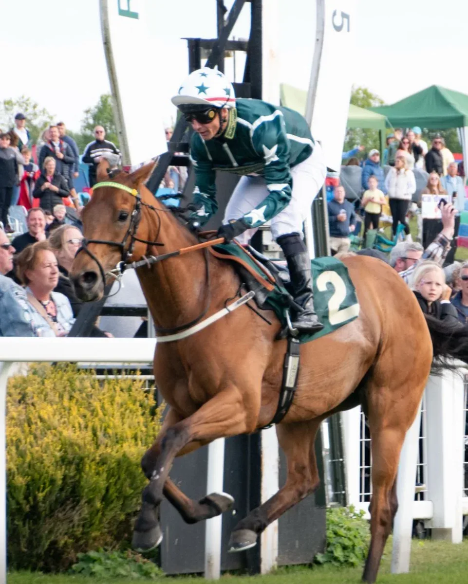 Heading to post in front of the crowd